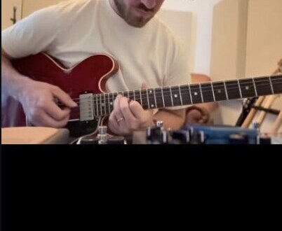 Phil Smith playing guitar